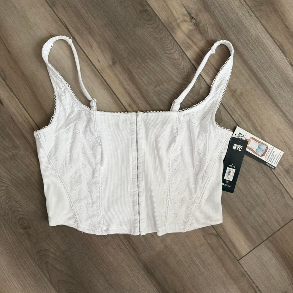 White corset top with eyelet lace detailing  madden summer loose corset